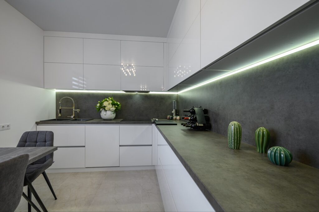 A view of a stylish dark gray countertop in a kitchen.